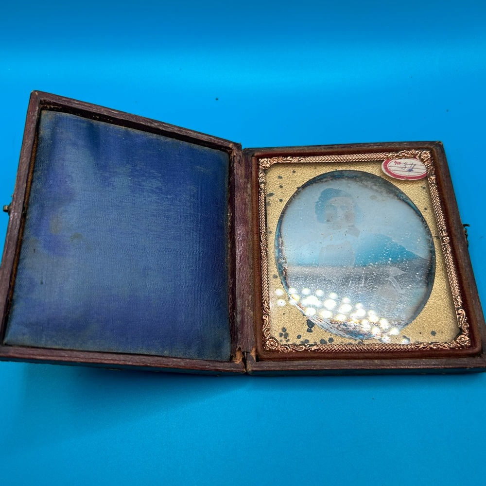 Antique tin type picture in original case, ornate gold, velvet lined